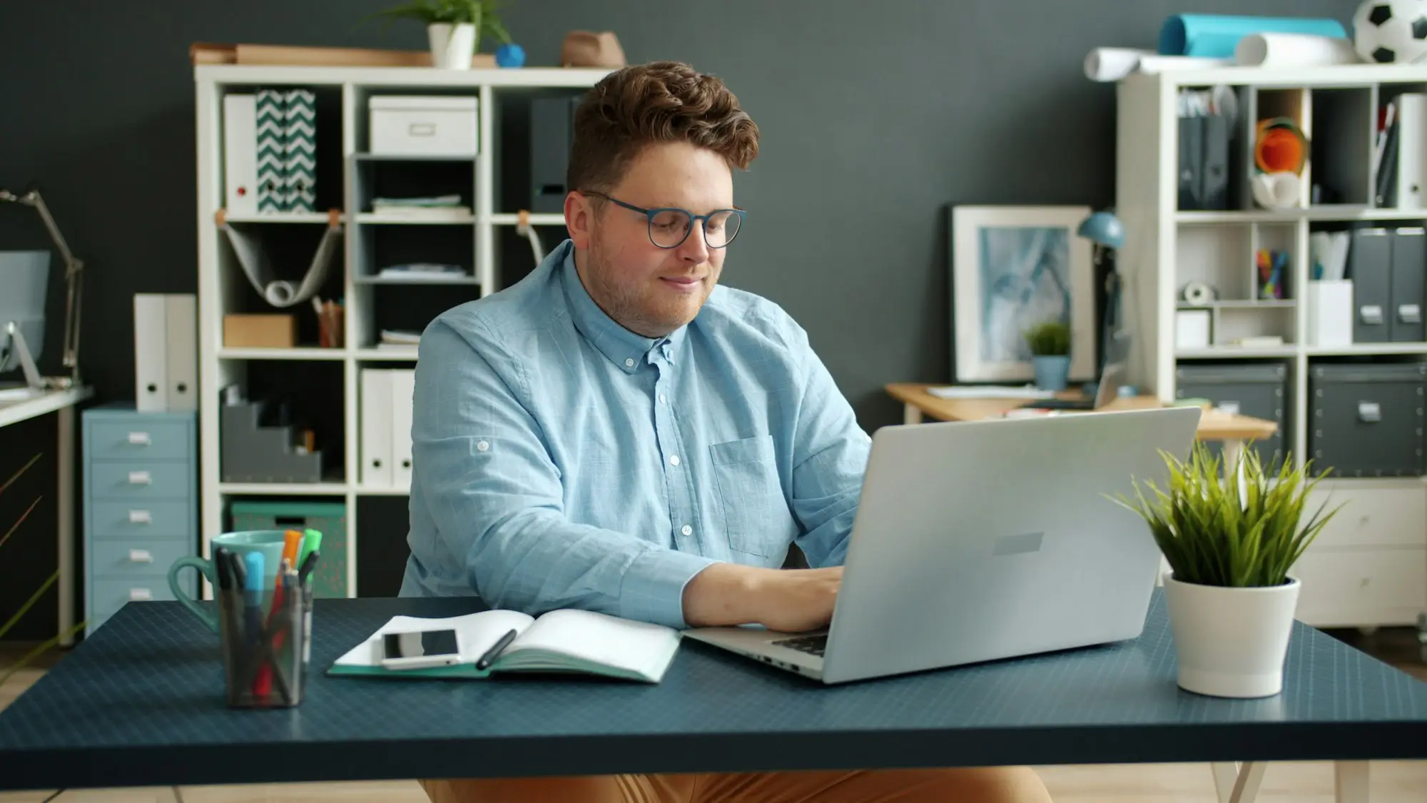 Man working on a laptop at his desk